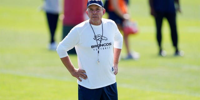 Sean Payton looks on at training camp