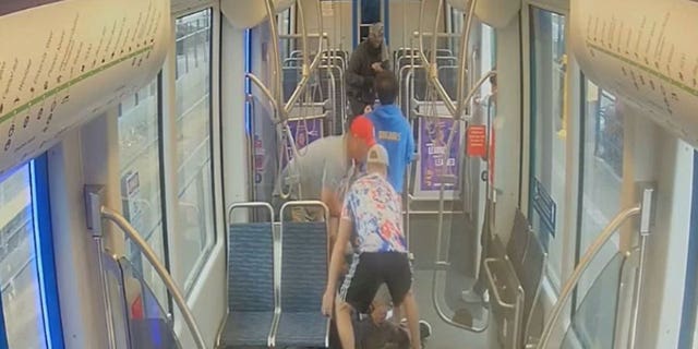 Passengers come to the aid of a fellow rider being attacked 