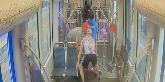Passengers come to the aid of a fellow rider being attacked