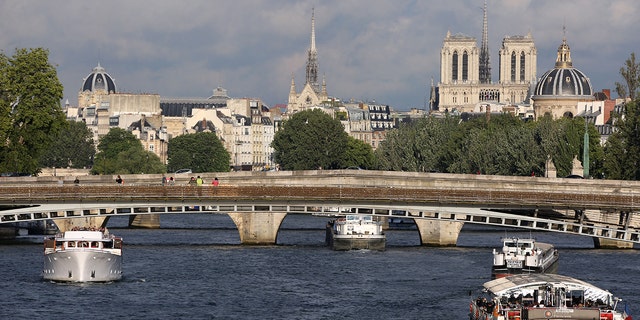 A boat sailing in the Seine River