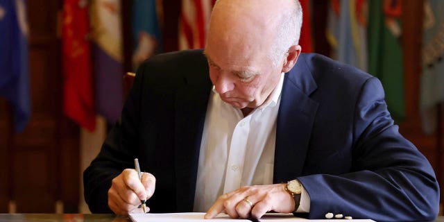 Republican Gov. Greg Gianforte signs a law 