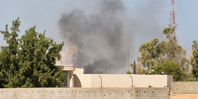 smoke rises in libya