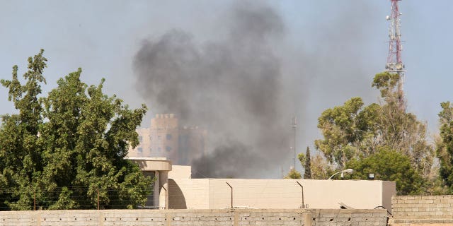 smoke rises in libya