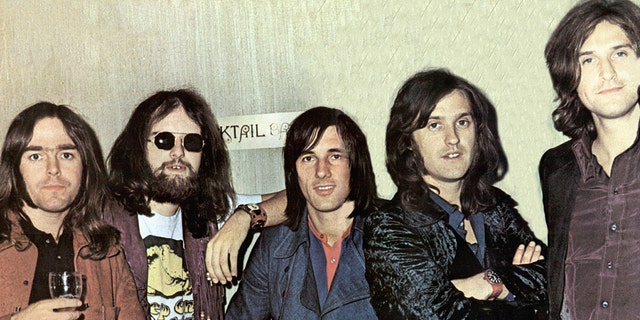 John Gosling poses with The Kinks in 1970