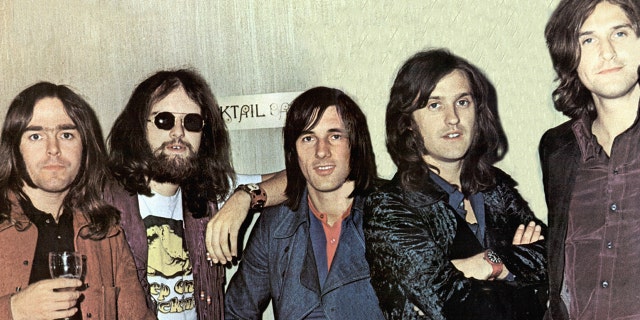 John Gosling poses with The Kinks in 1970