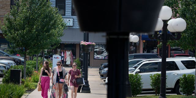 People walk through Tennessee town square
