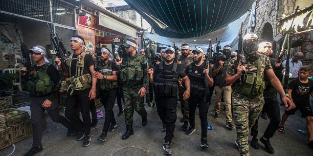 militant fighters holding guns