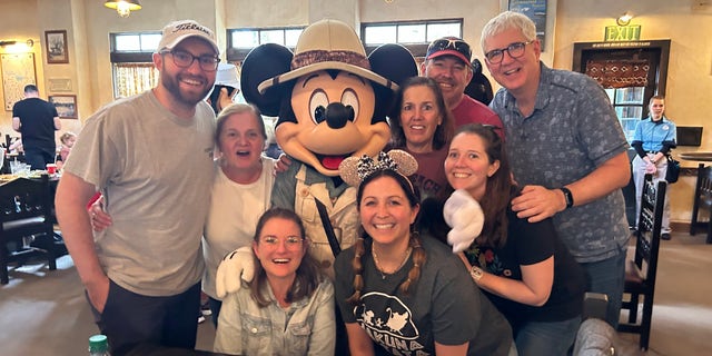 Sandy Caterine with family at Disney