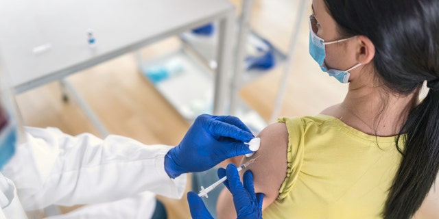 Woman getting vaccine