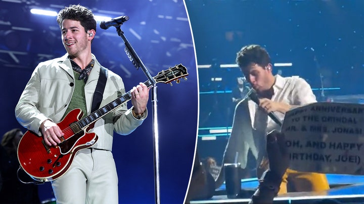 Nick Jonas falls into a hole onstage during Jonas Brothers concert