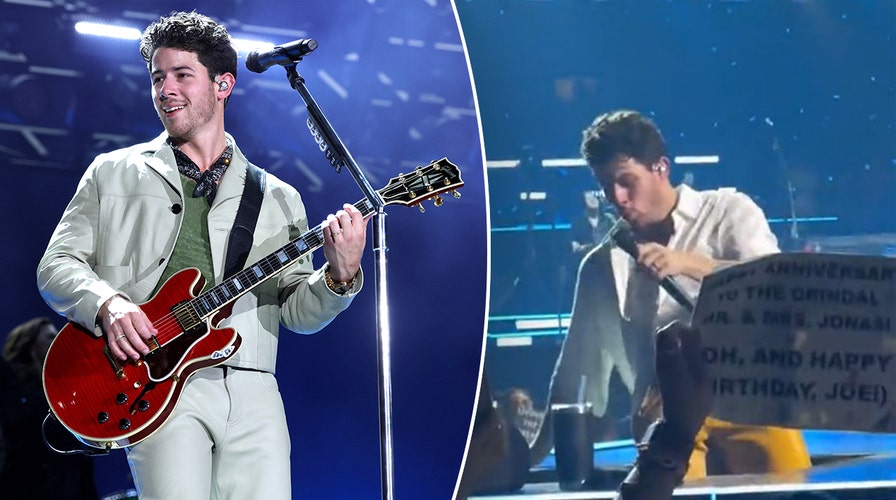 Nick Jonas falls into a hole onstage during Jonas Brothers concert