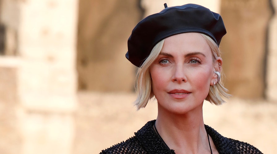 Charlize Theron scolds French TV host for kissing female interpreter: 'Ask next time'
