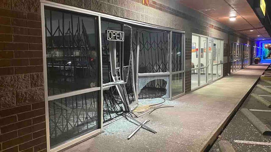 smashed store front and broken glass