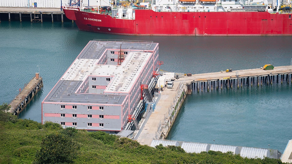 Britain removes migrants from barge after finding dangerous bacteria in water system