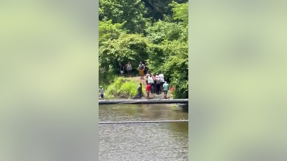 Soccer player dies from killer croc encounter while trying to cool off in river