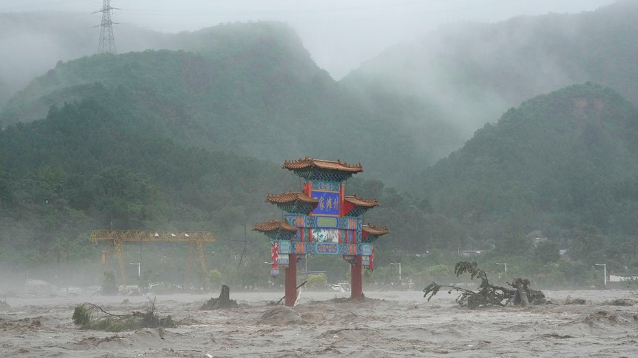 Thousands evacuated as Beijing flooding kills at least 20, leaves 27 others missing