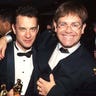 Steven Spielberg, Tom Hanks, and Elton John pose for a photo