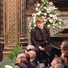 Elton John performs on stage at Princess Diana's funeral