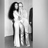 Cher and Elton John pose for a portrait