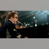 Elton John performs on stage
