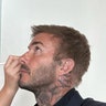 Harper Beckham doing David Beckham's makeup