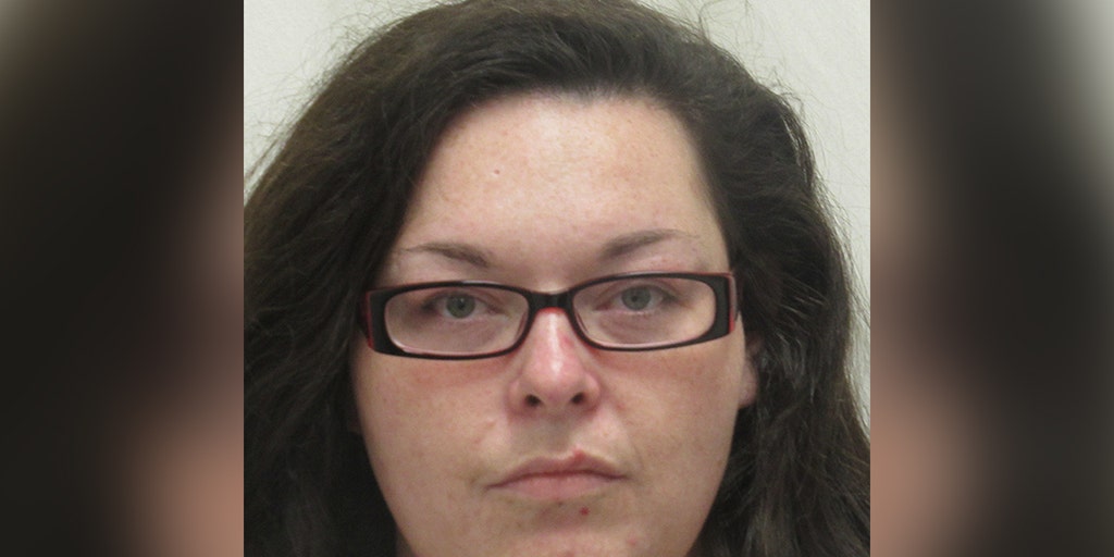 Woman charged after dead baby found in suitcase in doghouse - Vimarsana News