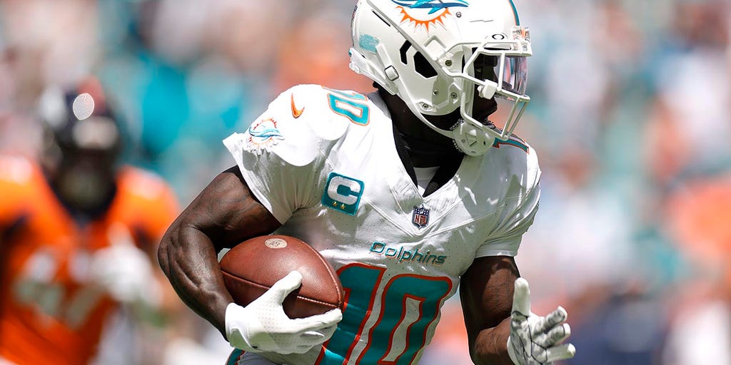 Miami Dolphins wide receiver Tyreek Hill (10) stands on the field