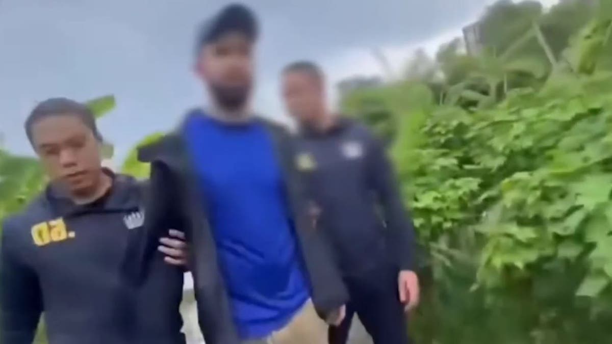 Luke Rockwell being arrested