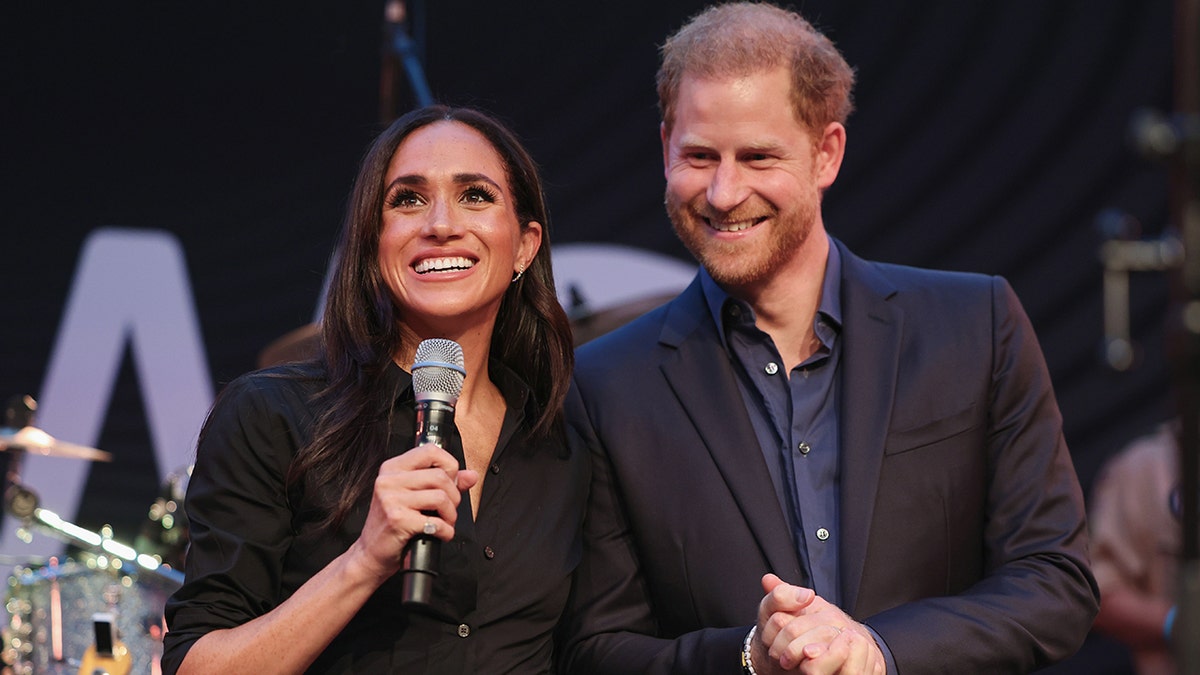 Prince Harry, Meghan Markle pack on PDA as they celebrate duke's 