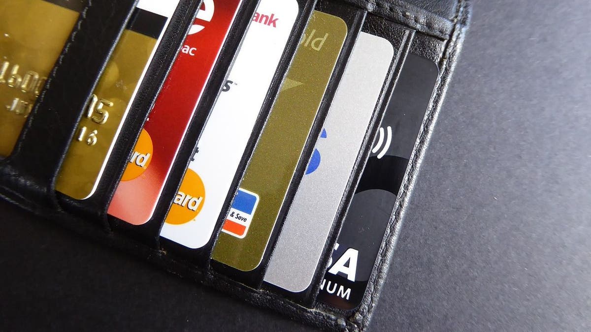 Photo of a wallet filled with credit cards.