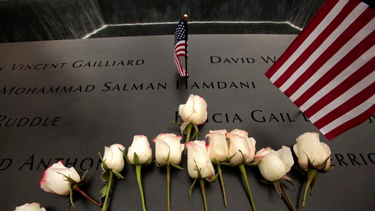 flowers on World Trade Center memorial wall