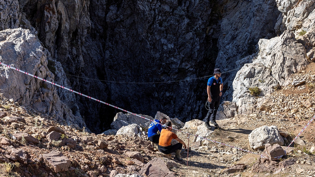 Climbers near the cave entrance