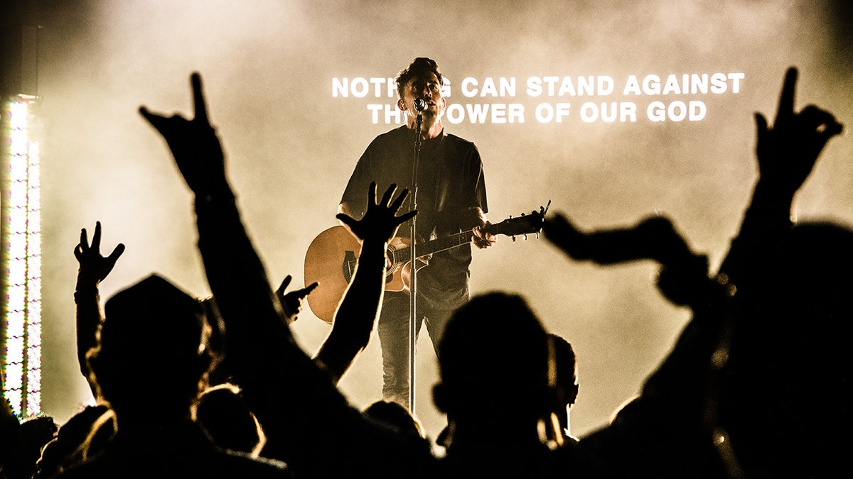 Man singing at worship summit