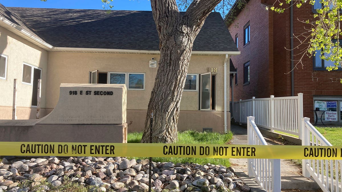 caution tape surrounds abortion clinic
