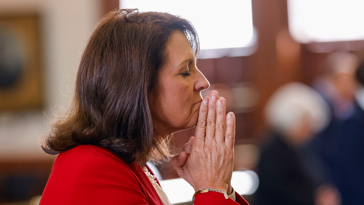 Paxton wife, a state senator herself, prays in chamber