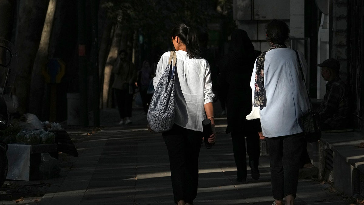 Iranian women walk without hijab