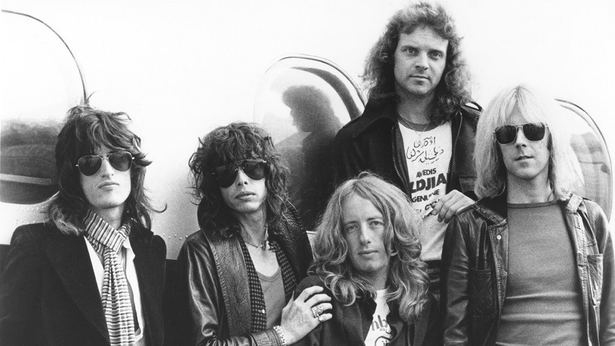 Black and white portrait of Aerosmith in the 1970s