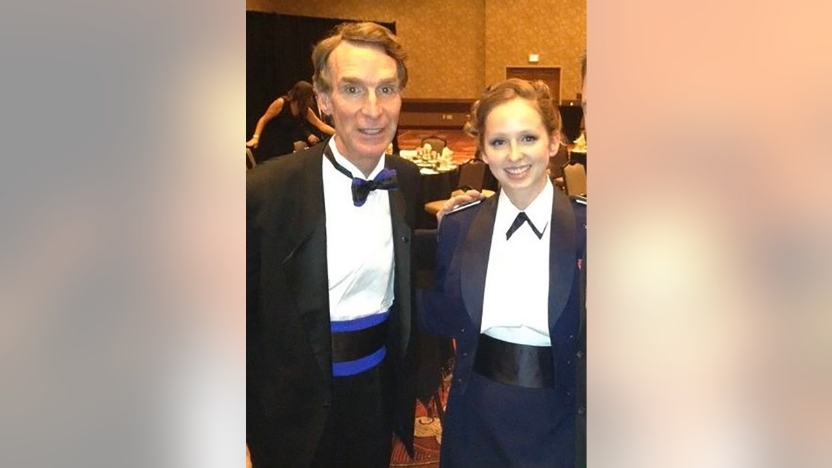 Sarah Lamp in a suit with Bill Nye the Science Guy