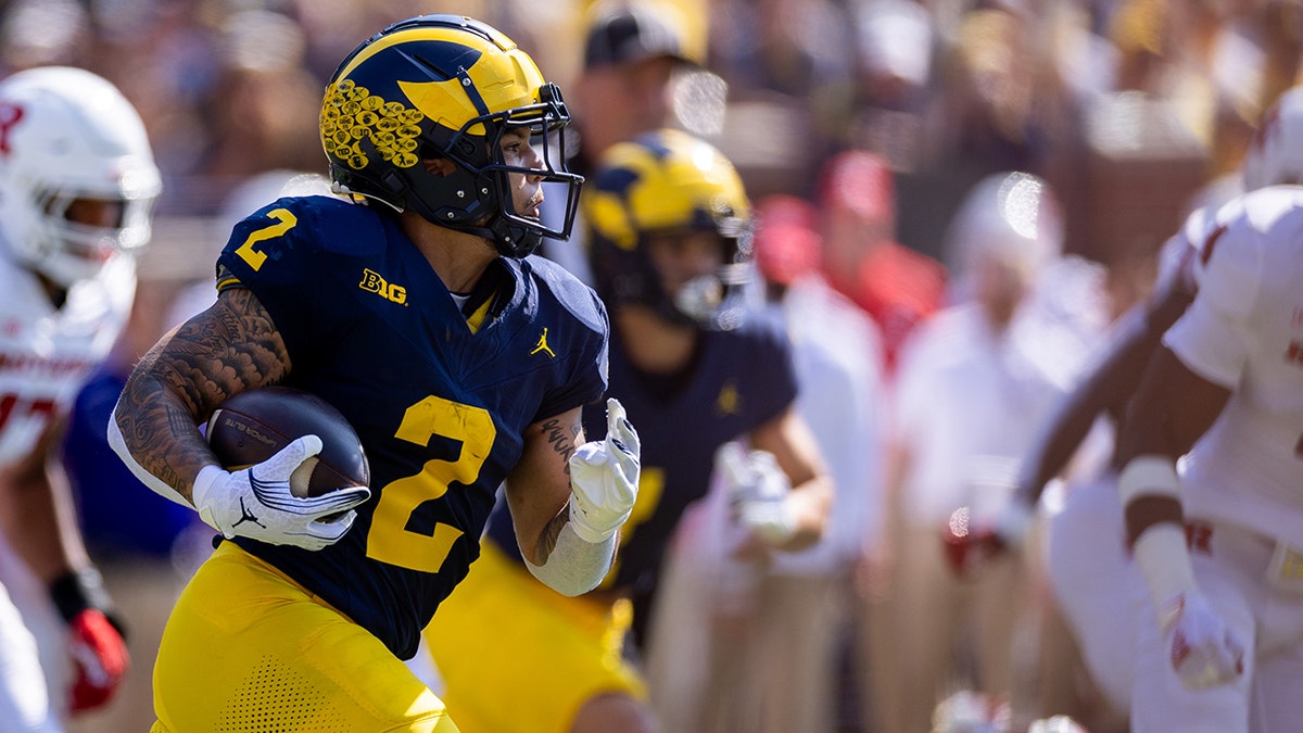 Michigan running back Blake Corum denies doing business with fired