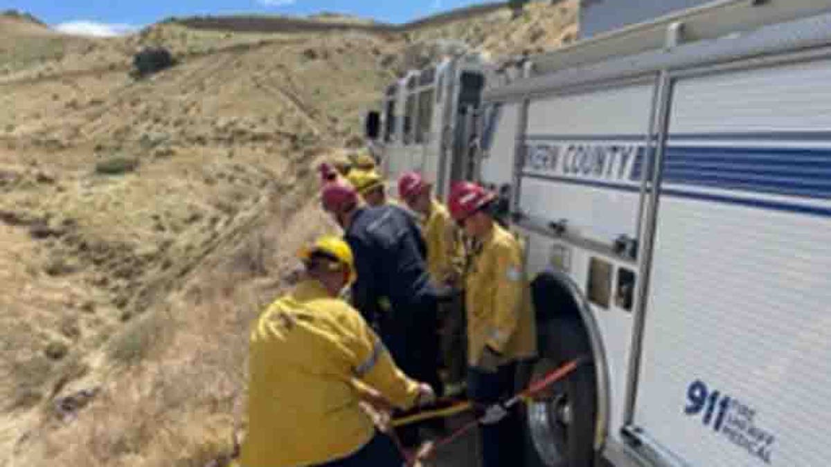 fire personnel along dirt road