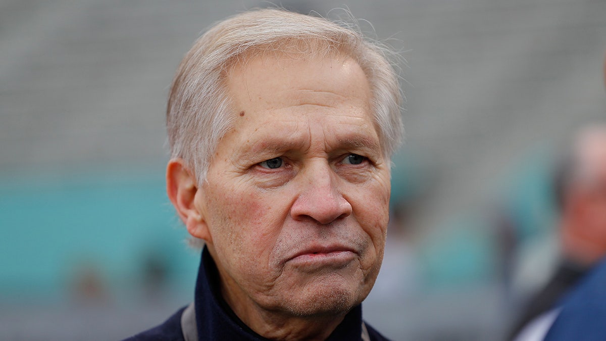 Chris Mortensen on the sidelines of a football game