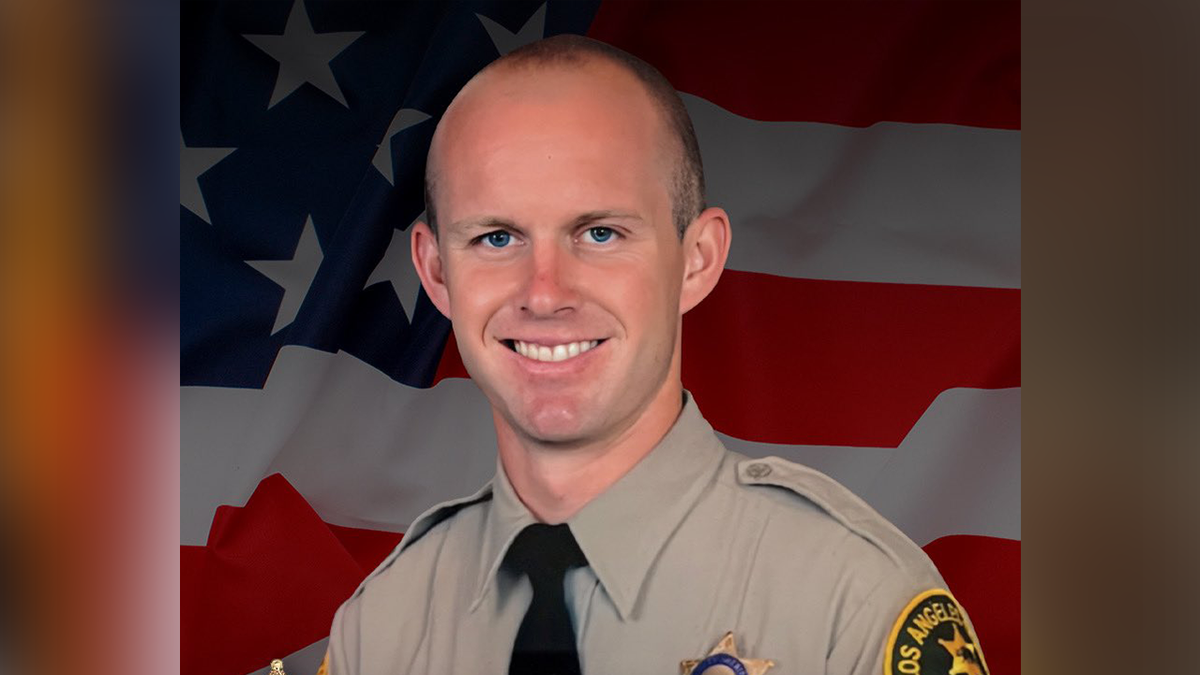 Los Angeles County Sheriff's Deputy Ryan Clinkunbroomer seen smiling in picture