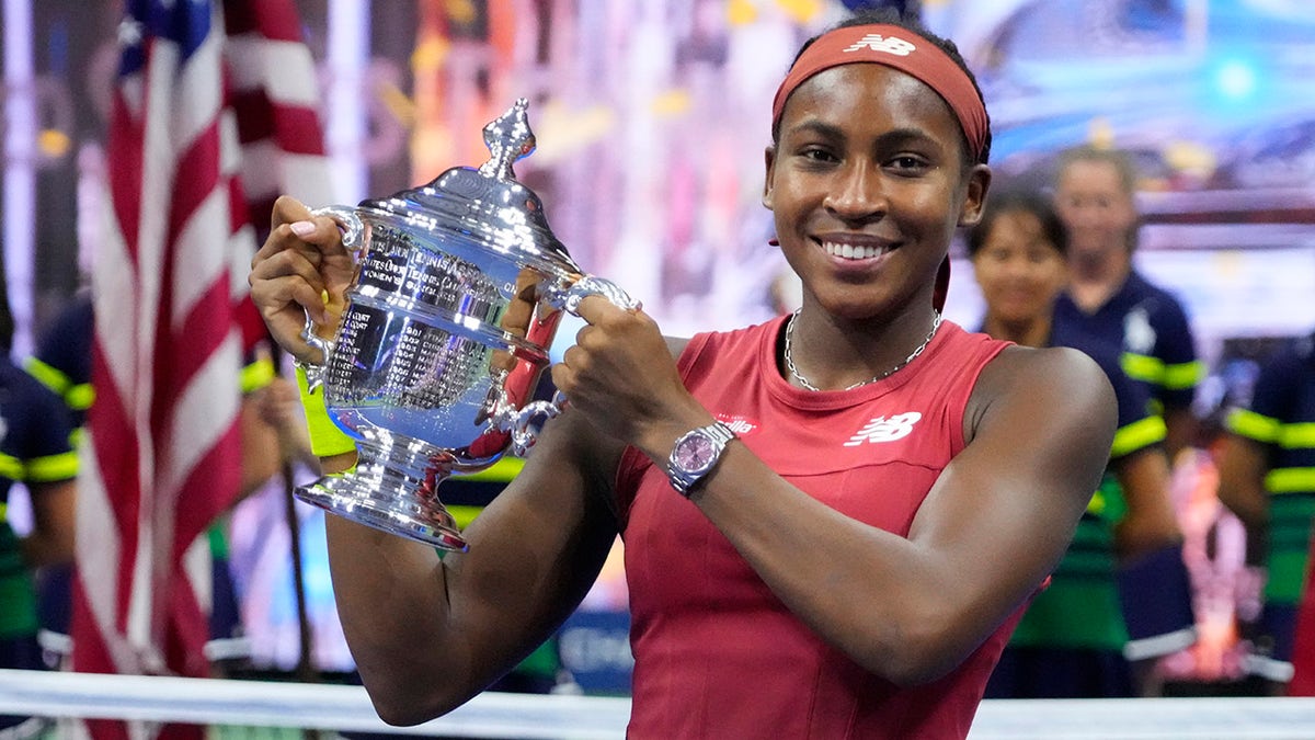 Coco Gauff holds the trophy