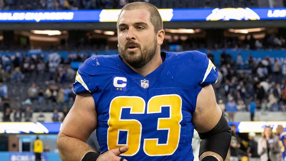 Corey Linsley jogs off the field