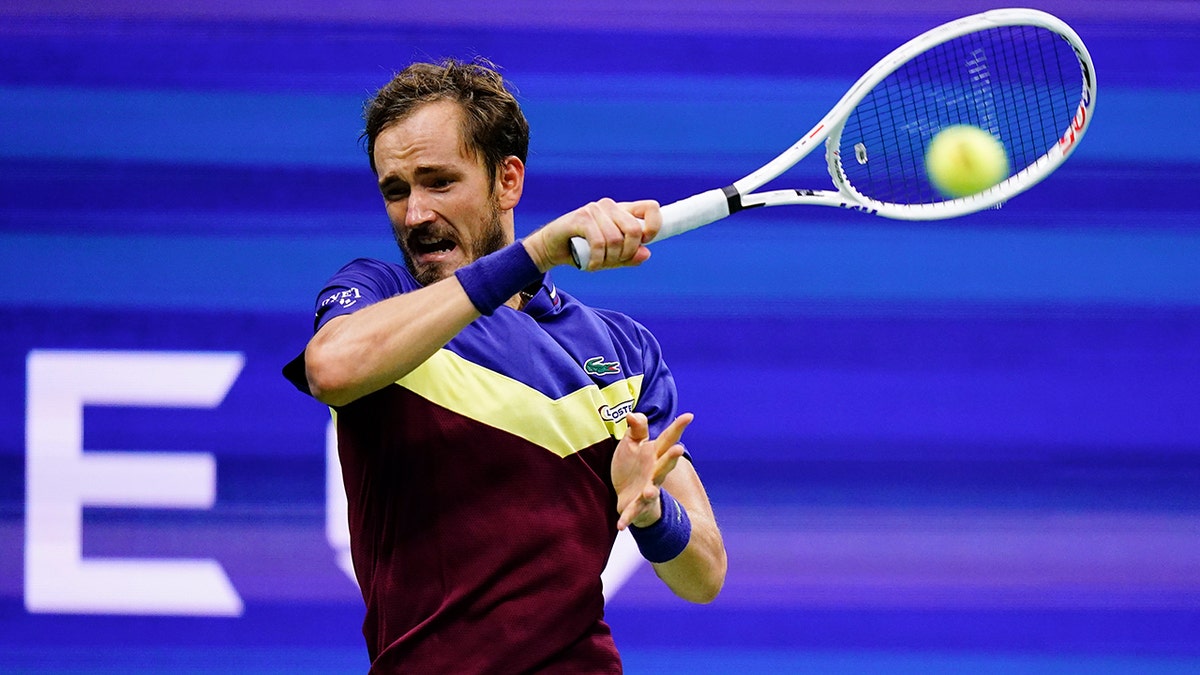 Daniil Medvedev returns a shot