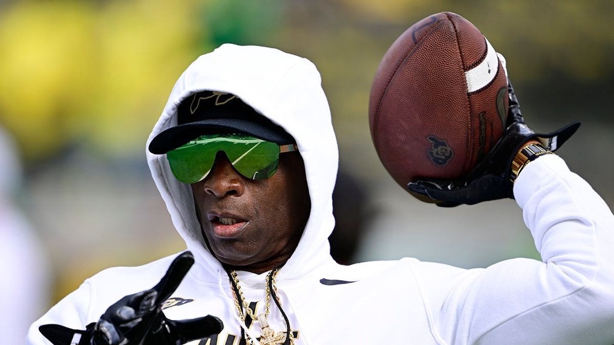 Deion Sanders plays catch