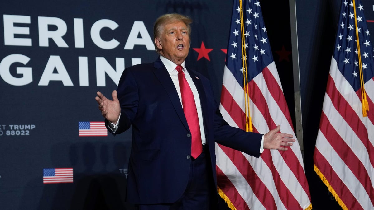 Former President Donald Trump in front of flag