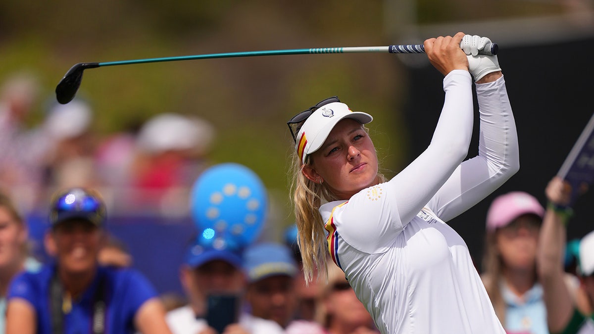 Emily Kristine Pedersen finishes golf swing