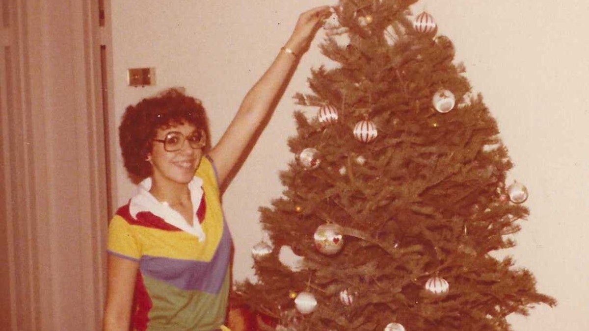 Kathy Kleiner Rubin decorates a Christmas tree after the attack in 1978