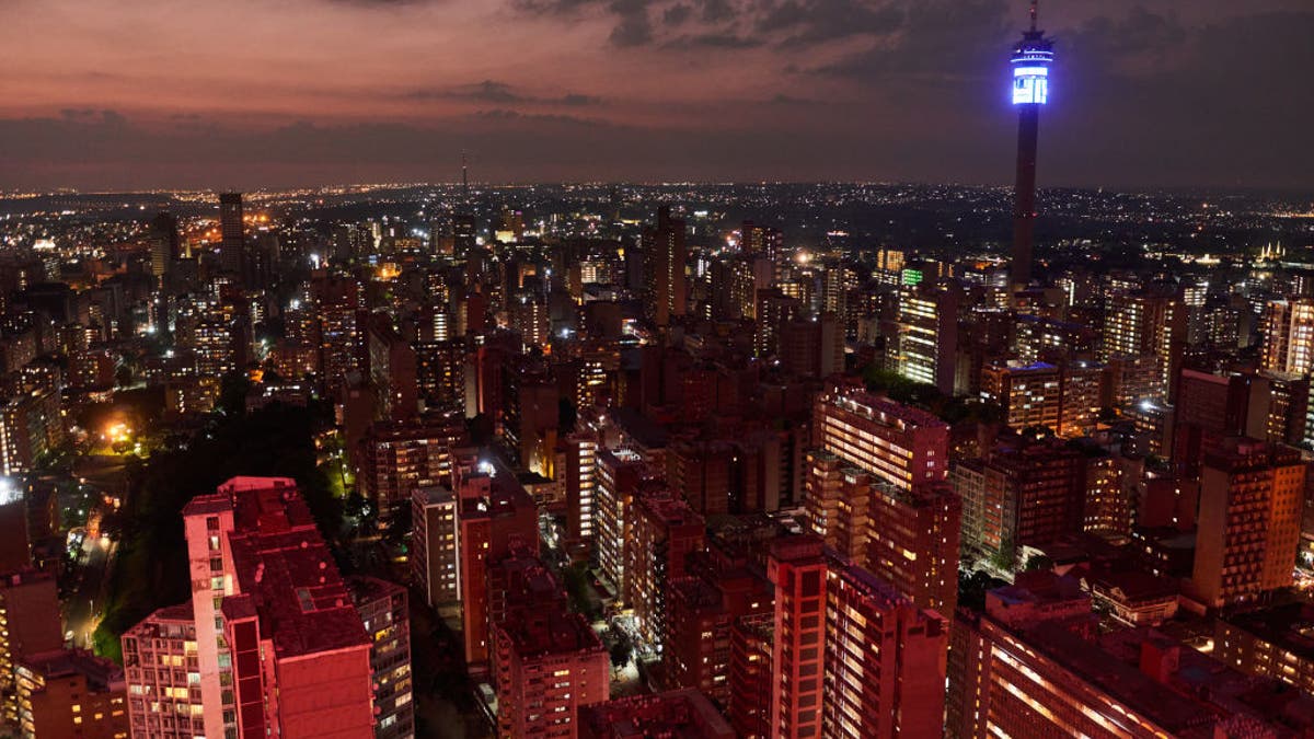 Married pilot snorts cocaine off topless woman in booze-fueled romp before flight: report Johannesburg skyline at night